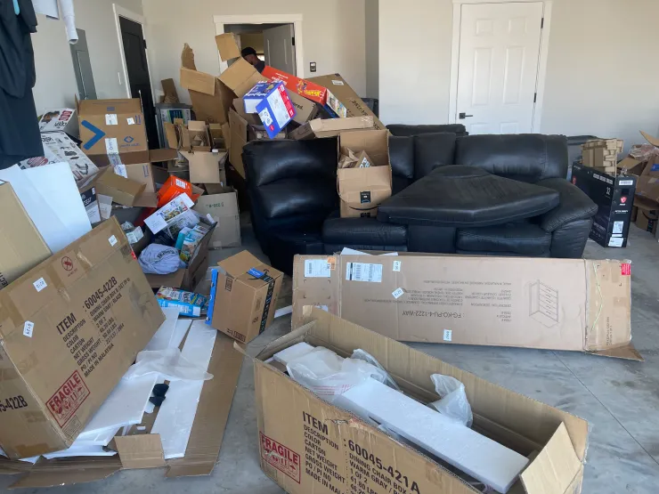 Furniture and boxes before cleanout service